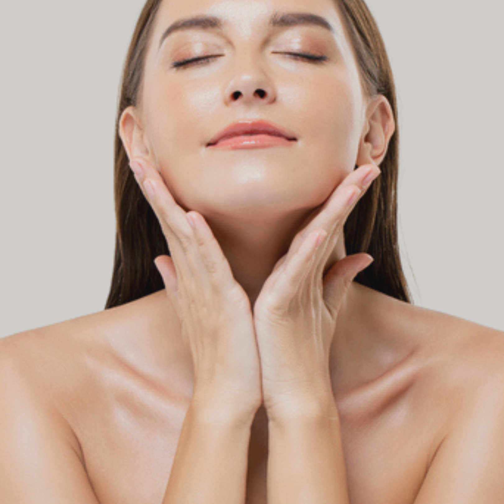 Relaxed woman with eyes closed holding face in hands